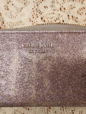 kate spade glitter lavender zip-around wallet with gold logo